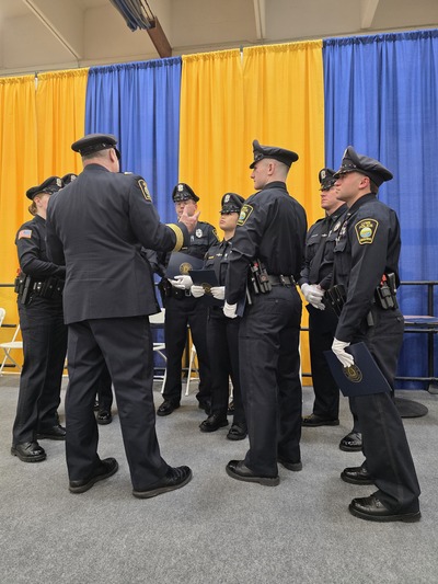 New officers meet with the Chief after graduation