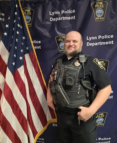 Officer Hynes wearing the bronze badge